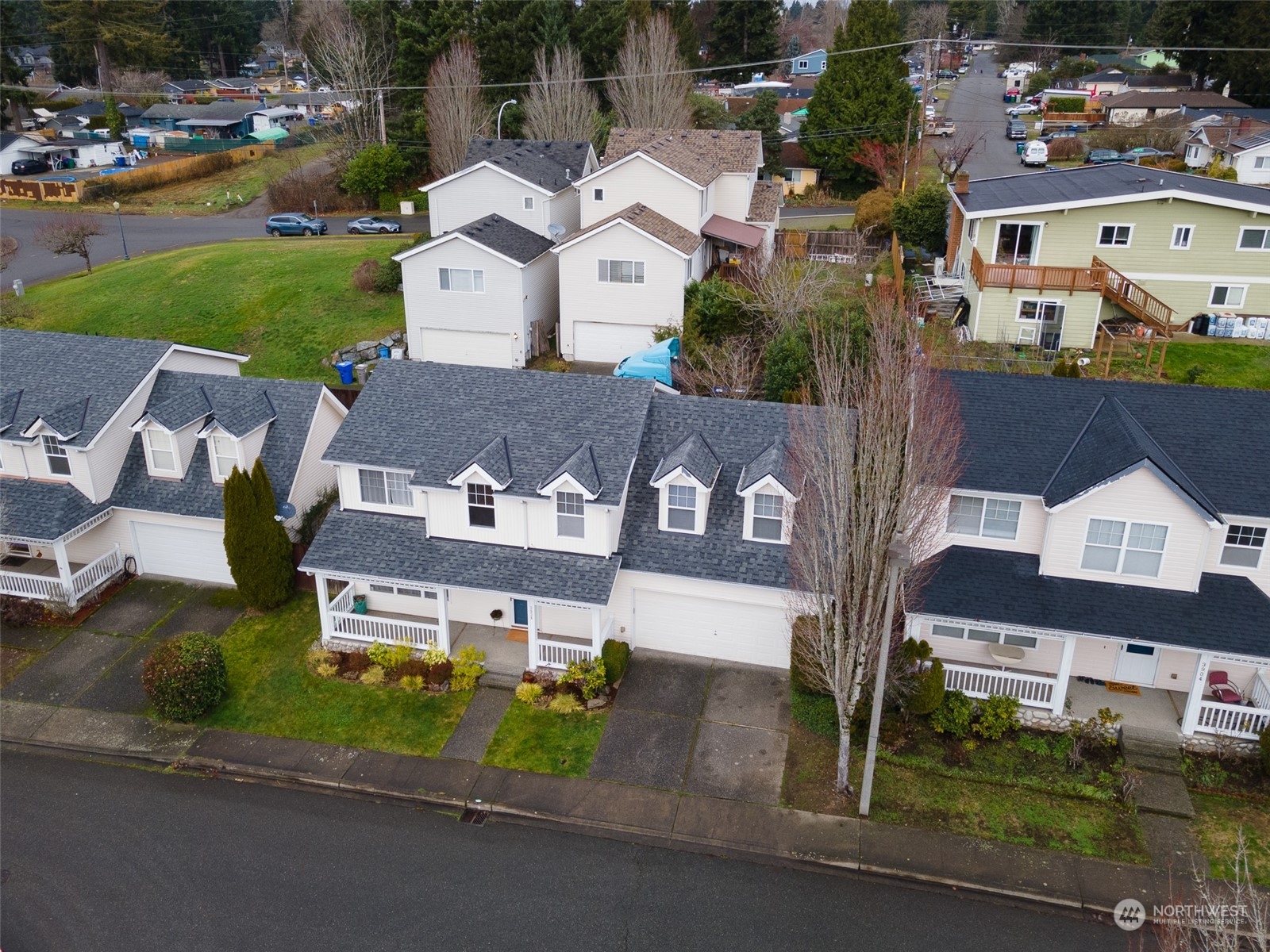3834 Northeast 5th Place Renton, WA 98056 - Photo 3 of 39 an aerial view of multiple houses with a yard
