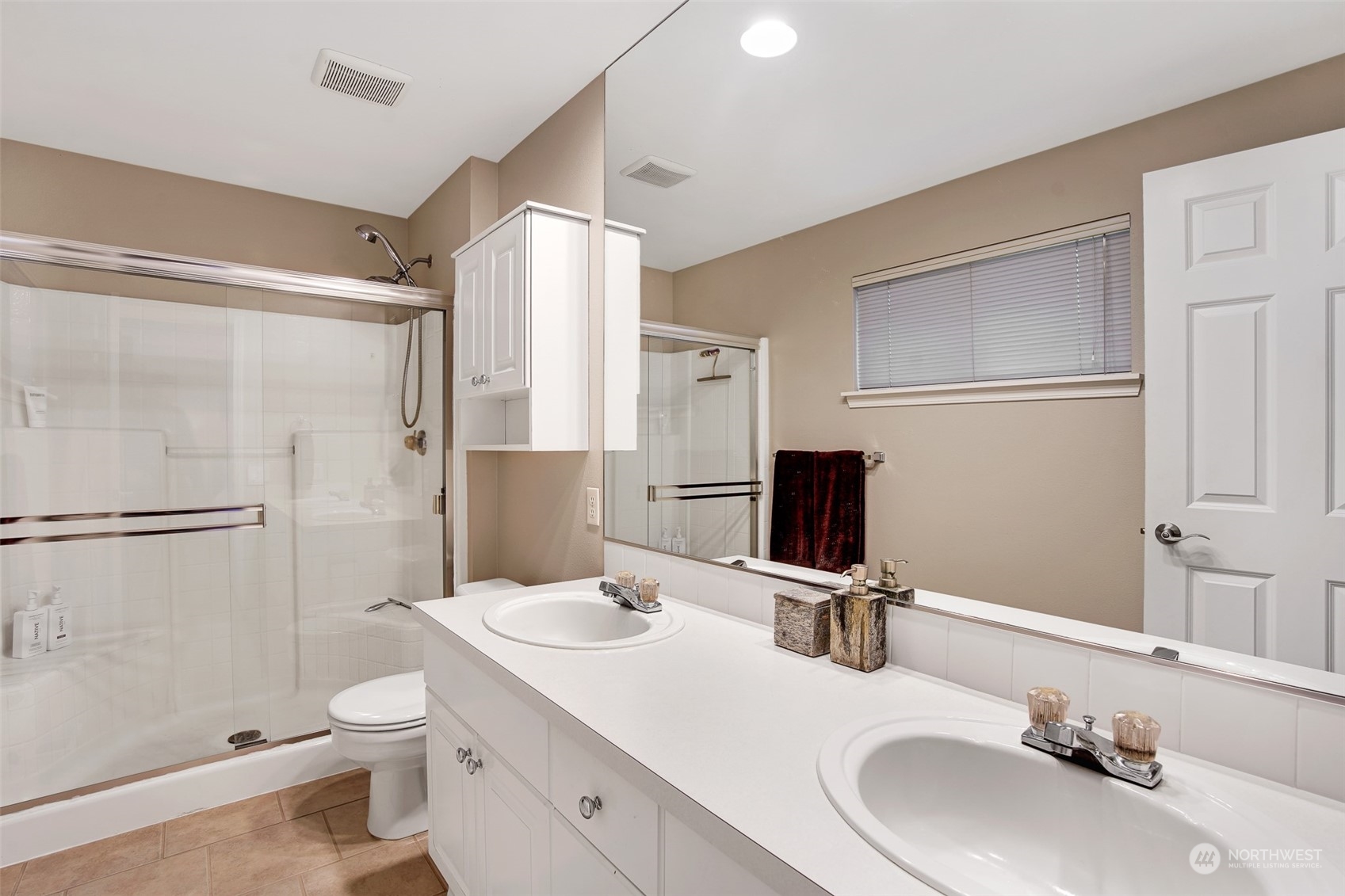 3834 Northeast 5th Place Renton, WA 98056 - Photo 33 of 39 a bathroom with a granite countertop sink toilet and shower