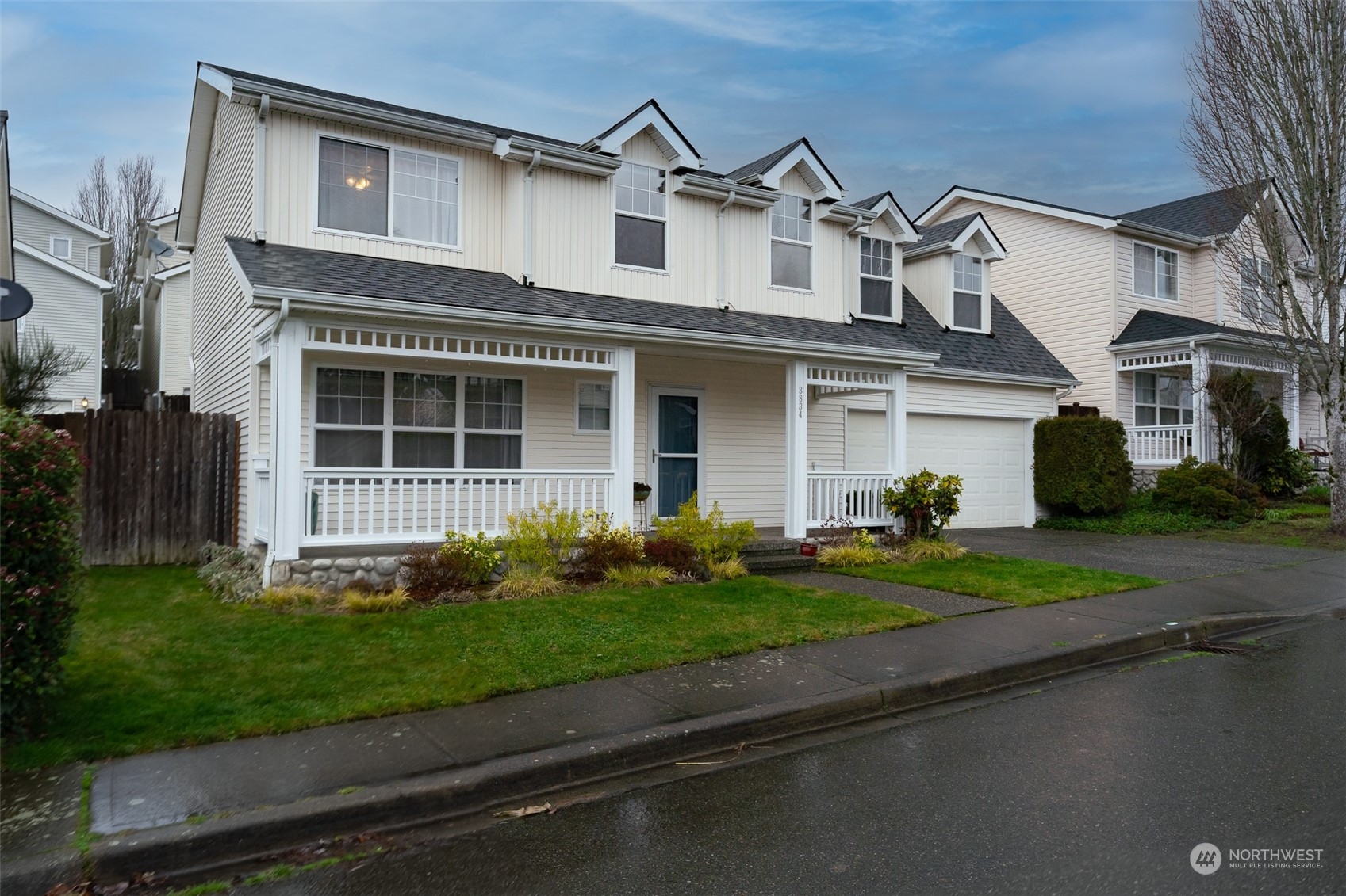 3834 Northeast 5th Place Renton, WA 98056 - Photo 8 of 39 a front view of a house with garden