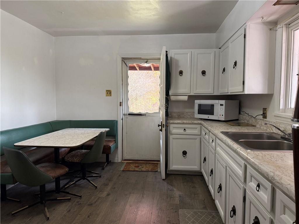 2086 River Hill Road Monongahela, PA 15063 - Photo 4 of 23 a kitchen with cabinets appliances and wooden floor