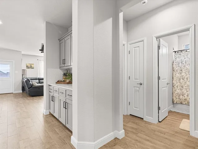 a kitchen with stainless steel appliances kitchen island granite countertop a refrigerator and a sink