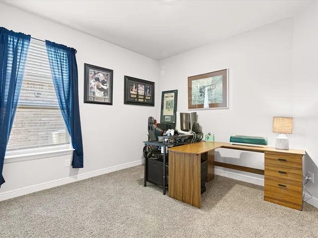 a view of a workspace with furniture