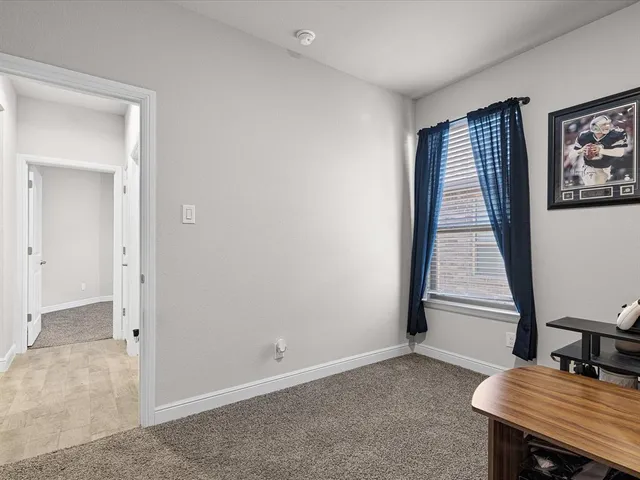 a view of a room with a window and gate
