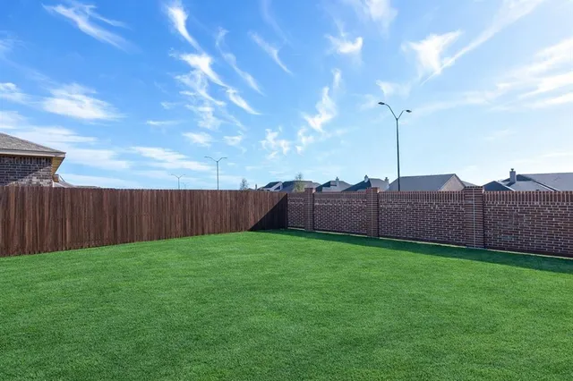 a view of a backyard with a garden