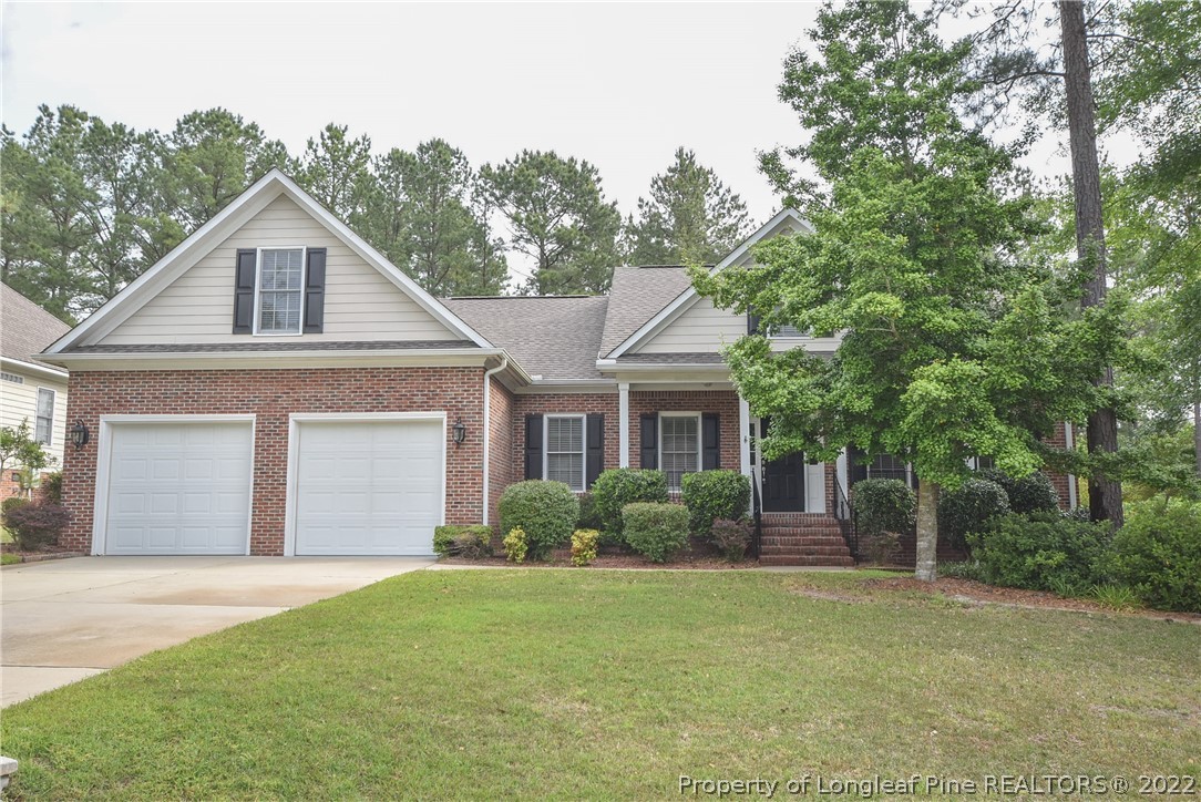 36 Falling Water Road Spring Lake, NC 28390 - Photo 1 of 50 a front view of a house with garden