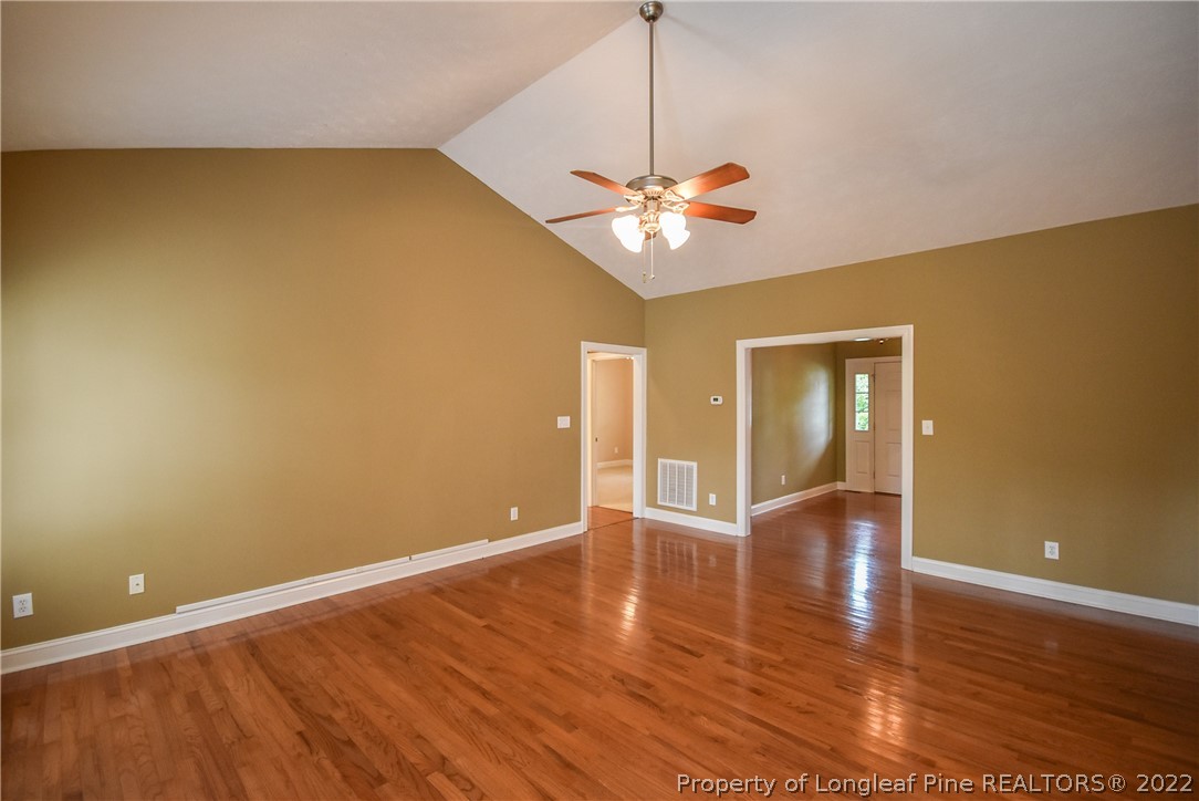 36 Falling Water Road Spring Lake, NC 28390 - Photo 12 of 50 a view of empty room with wooden floor and fan