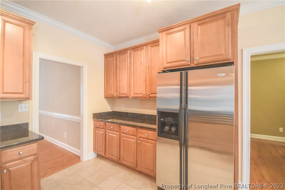 36 Falling Water Road Spring Lake, NC 28390 - Photo 18 of 50 a kitchen with a refrigerator a stove a sink and a cabinets