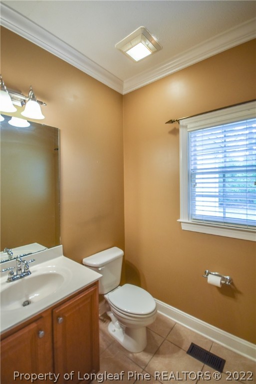 36 Falling Water Road Spring Lake, NC 28390 - Photo 26 of 50 a bathroom with a sink a toilet and a vanity