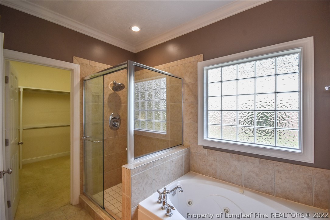 36 Falling Water Road Spring Lake, NC 28390 - Photo 32 of 50 a bathroom with a tub shower and sink