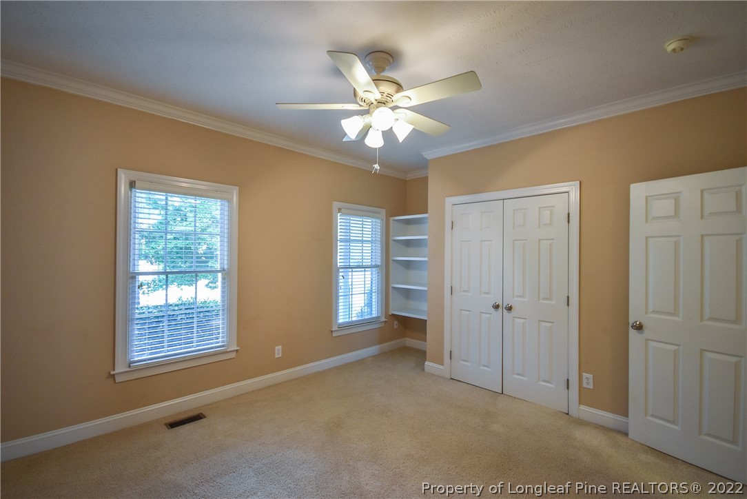36 Falling Water Road Spring Lake, NC 28390 - Photo 39 of 50 a view of an empty room with window and chandelier fan