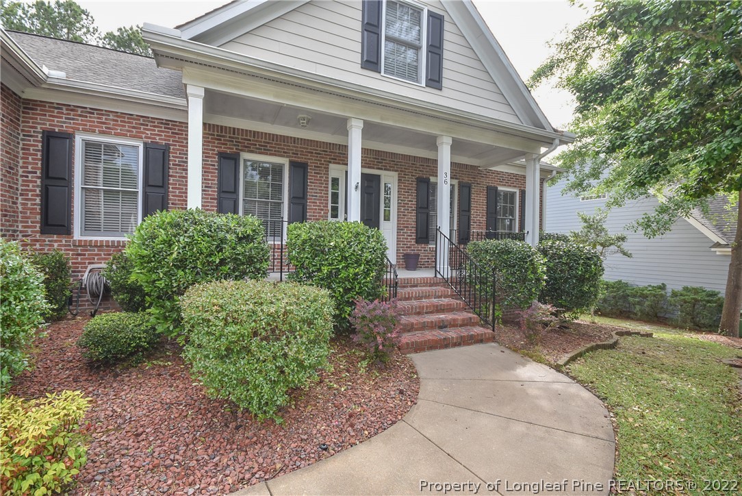 36 Falling Water Road Spring Lake, NC 28390 - Photo 5 of 50 front view of a brick house with a yard