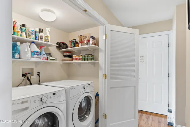 a view of storage and utility room with baby crib