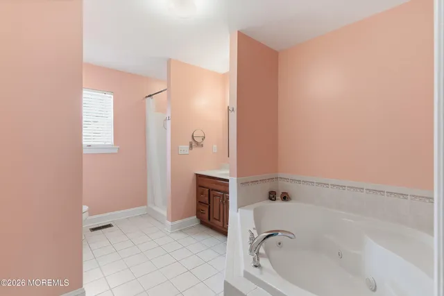 a bathroom with a bathtub and a shower