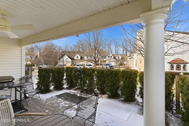 a view of a chairs and table in patio
