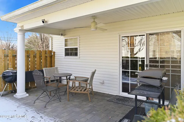 a outdoor space with a large window and sitting area