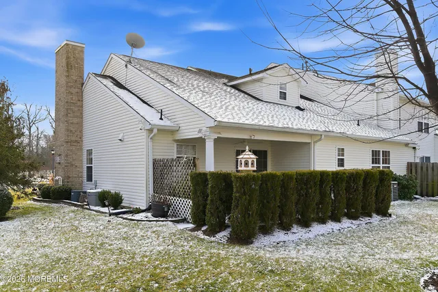 a view of a house with a snow in the yard