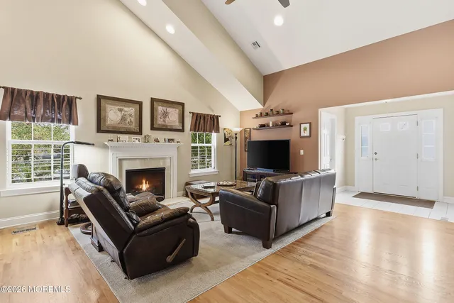a living room with furniture and a fireplace