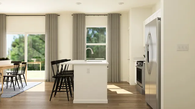 a view of a livingroom with furniture window and wooden floor