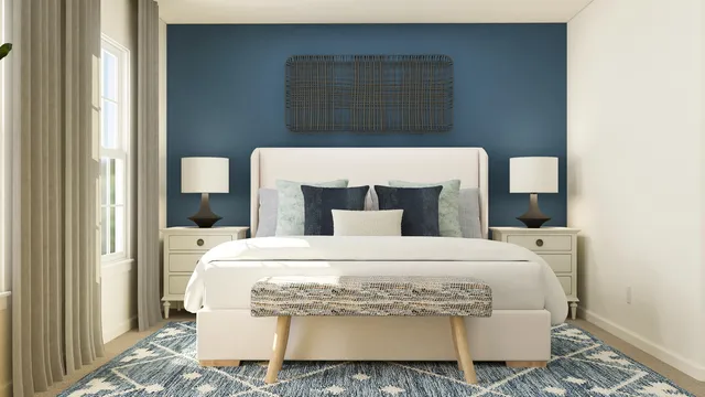 a large white bed in a white room