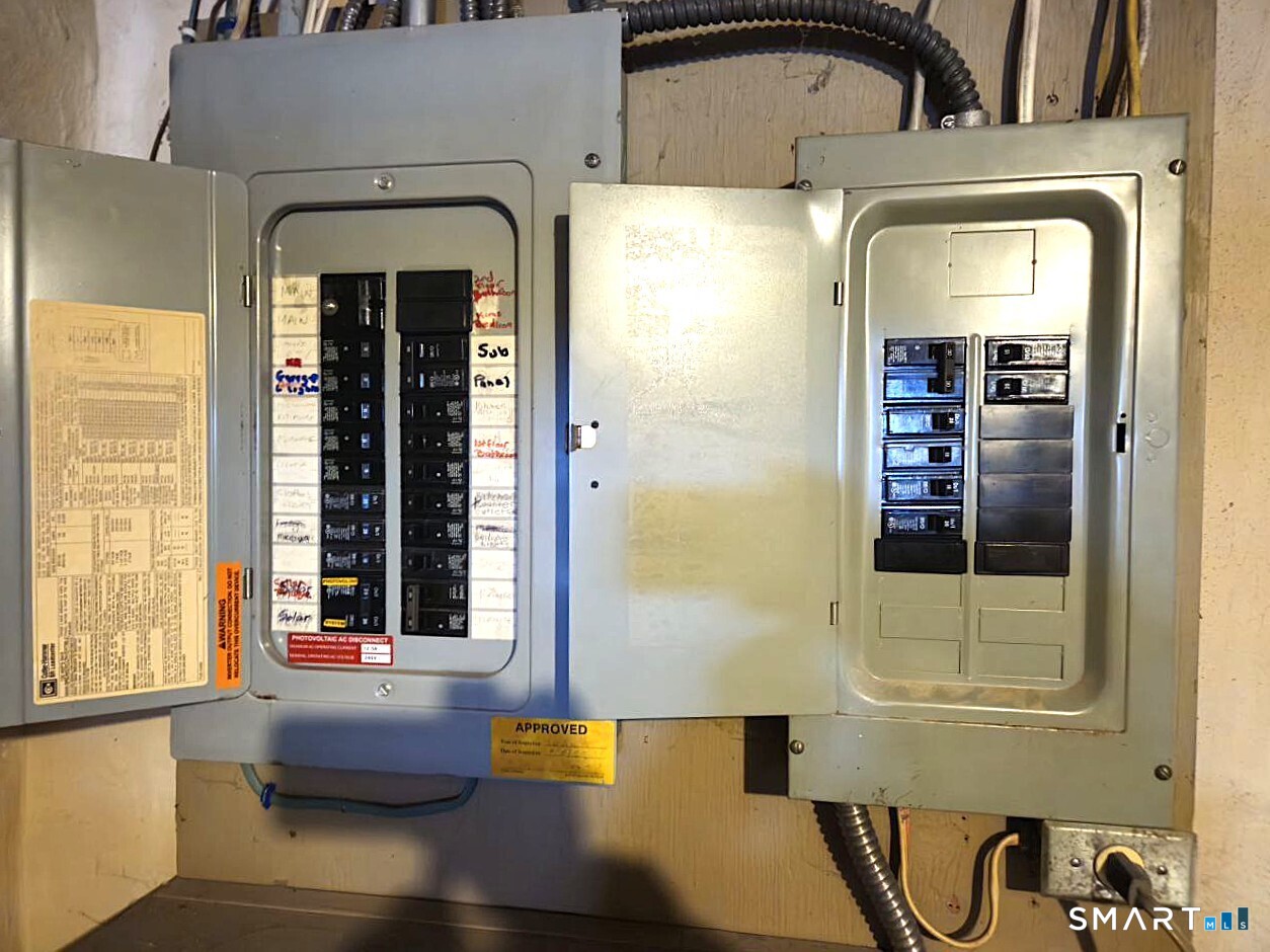 35 Lardner Road Bristol, CT 06010 - Photo 26 of 40 a front view of a house with large windows