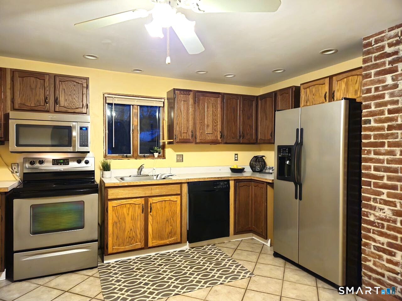 35 Lardner Road Bristol, CT 06010 - Photo 33 of 40 a kitchen with stainless steel appliances granite countertop a refrigerator and a stove top oven