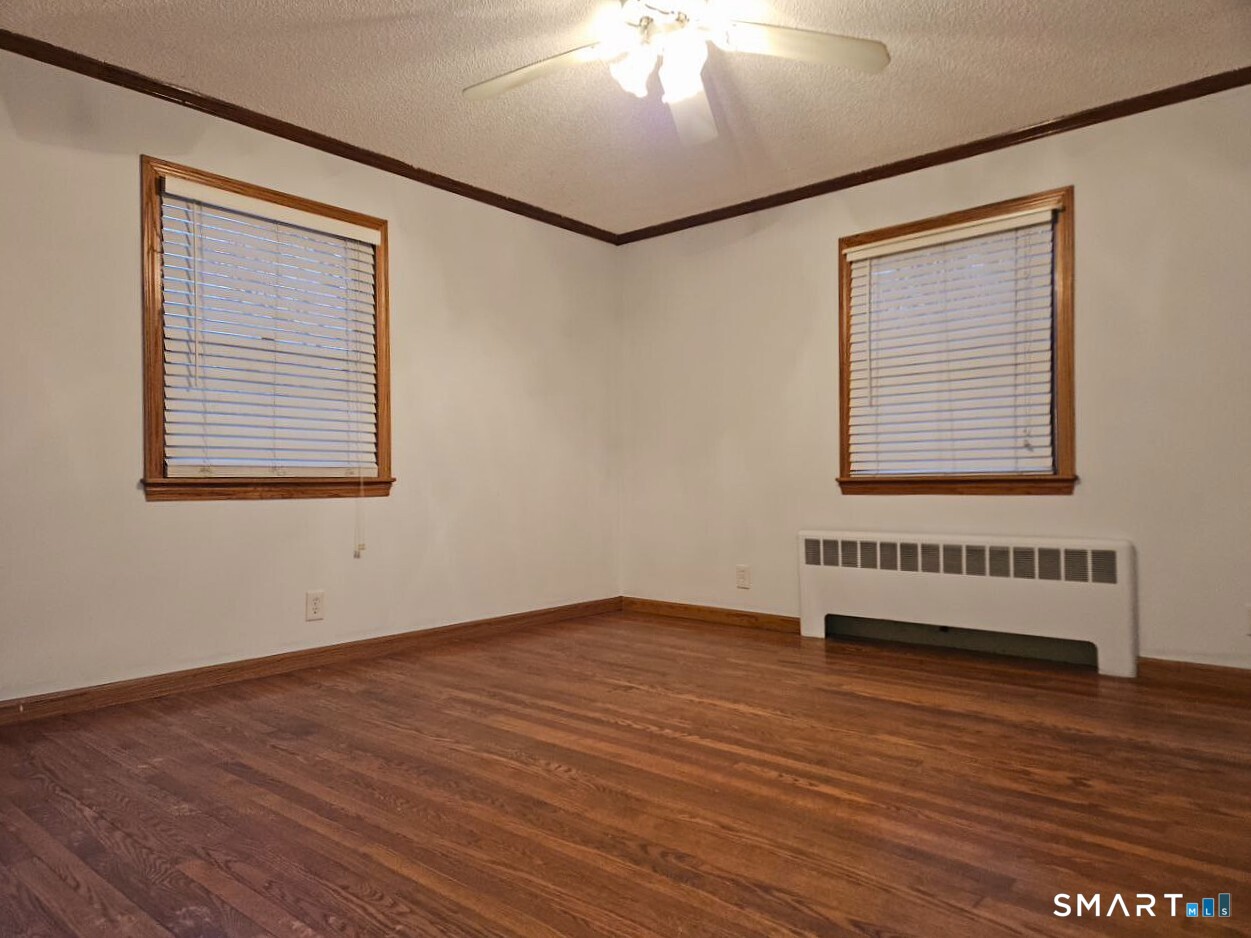 35 Lardner Road Bristol, CT 06010 - Photo 38 of 40 a view of a room with wooden floor and cabinet