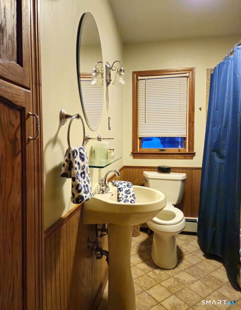 35 Lardner Road Bristol, CT 06010 - Photo 6 of 40 a bathroom with a sink mirror and toilet