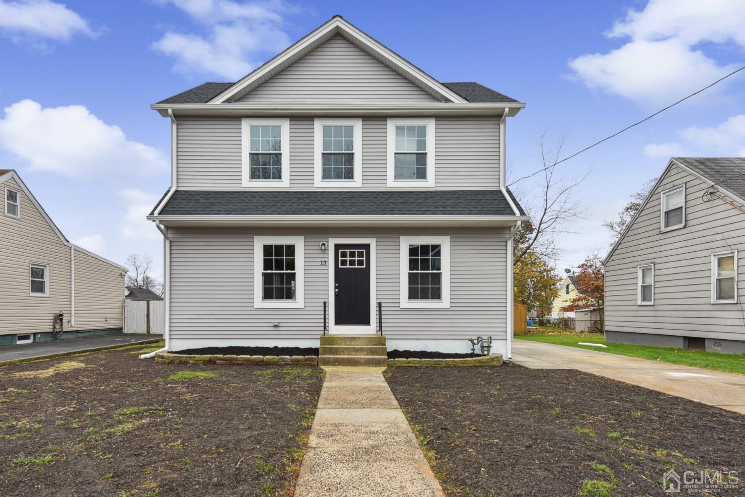a front view of a house with a yard