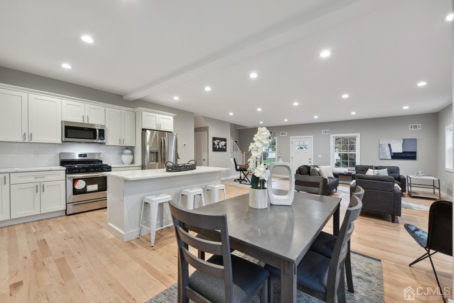 13 Albany Street Edison, NJ 08837 - Photo 12 of 26 a large kitchen with dining table and chairs