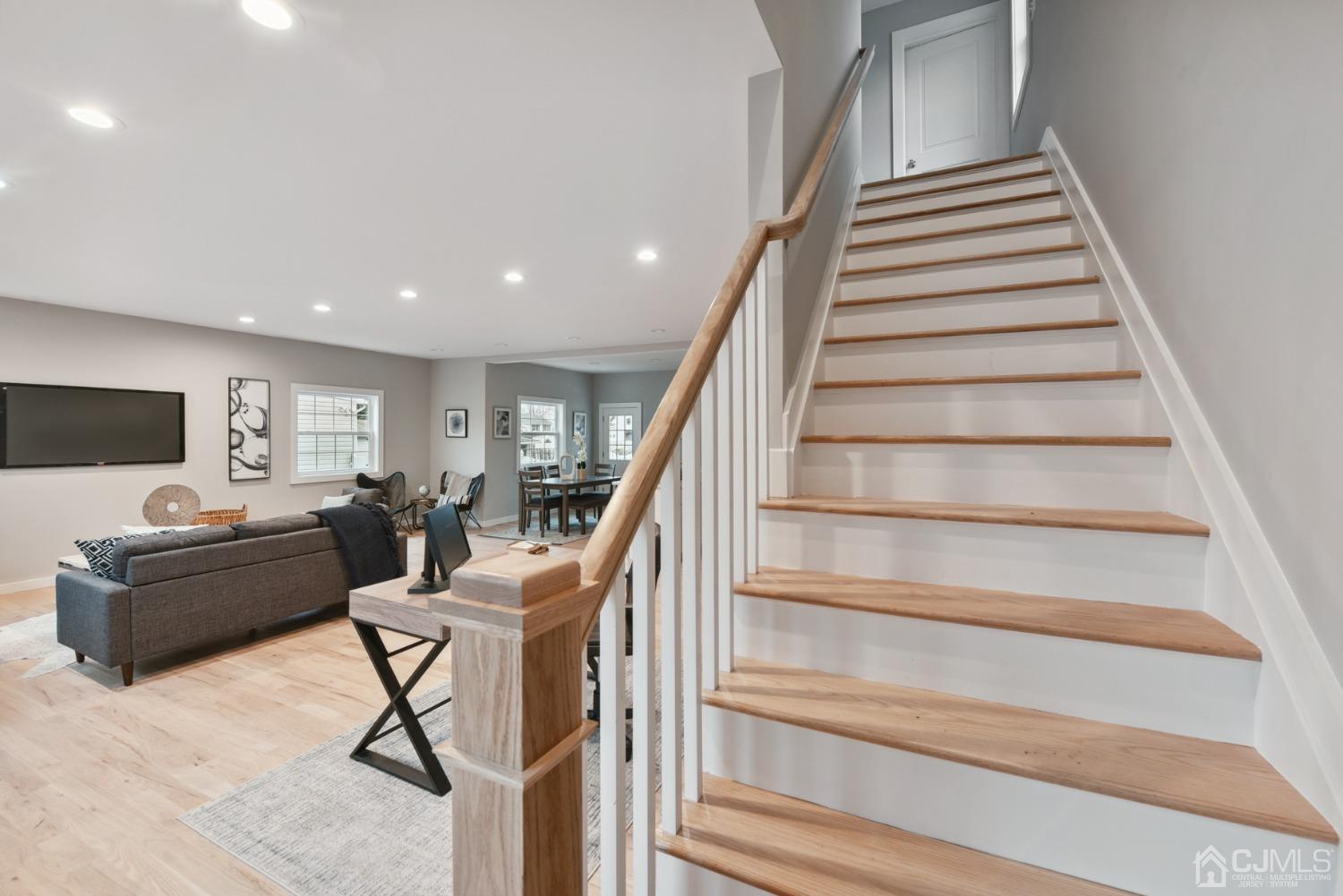 13 Albany Street Edison, NJ 08837 - Photo 14 of 26 a living room with furniture and stairs