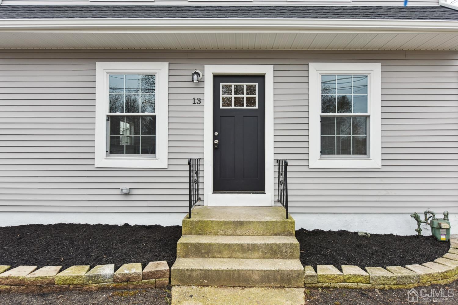 13 Albany Street Edison, NJ 08837 - Photo 2 of 26 a front view of a house with a yard
