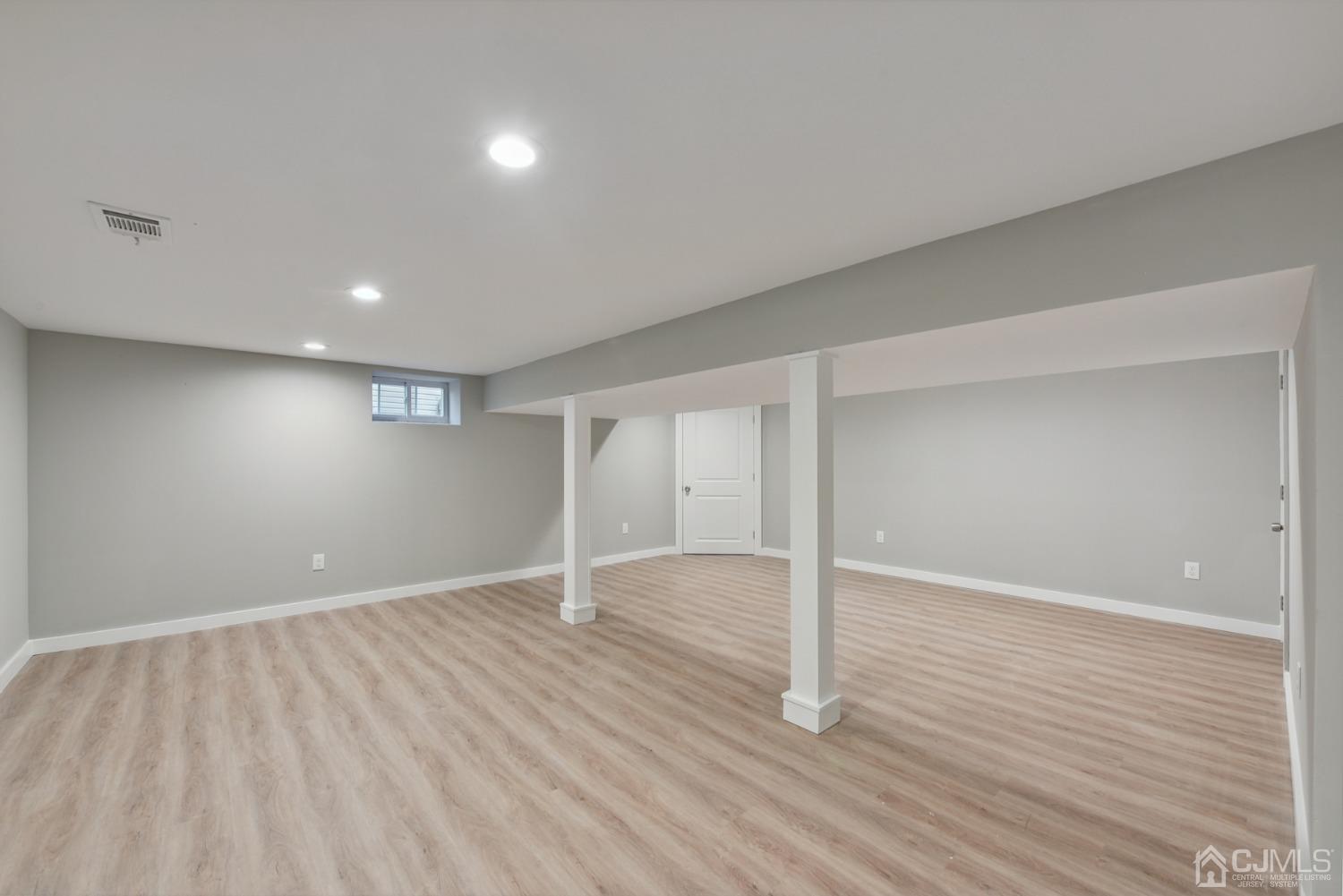 13 Albany Street Edison, NJ 08837 - Photo 24 of 26 wooden floor in an empty room with a window