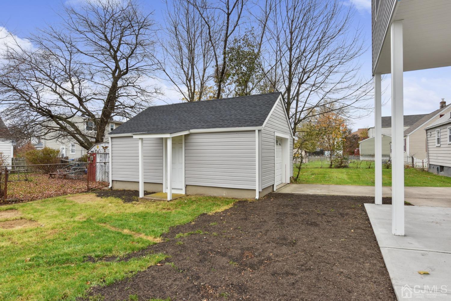 13 Albany Street Edison, NJ 08837 - Photo 25 of 26 a view of a house with a yard and garage