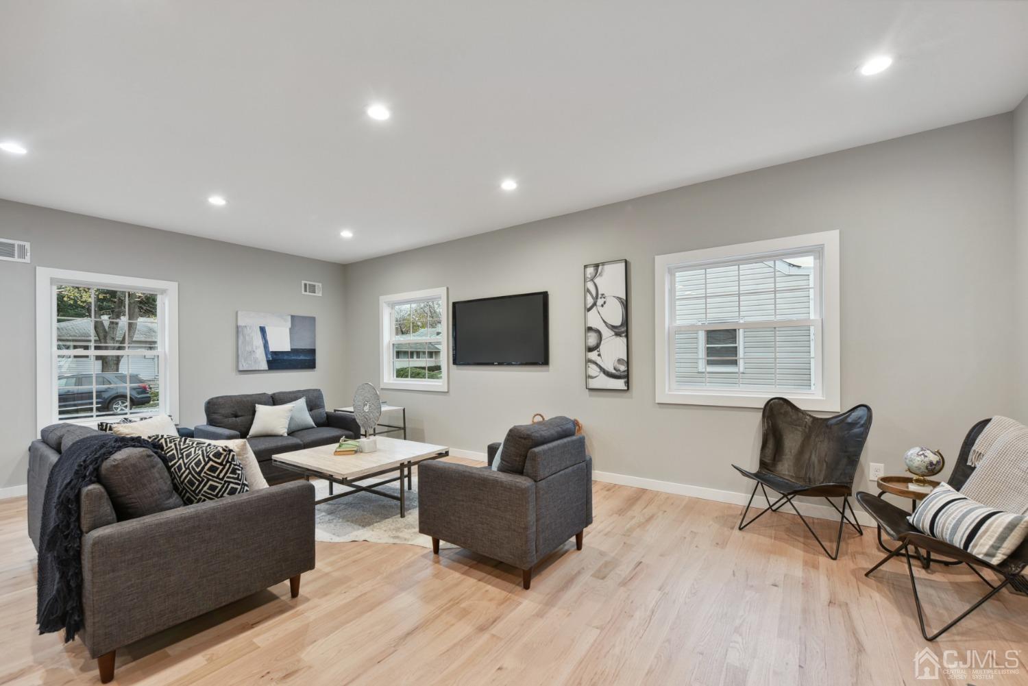 13 Albany Street Edison, NJ 08837 - Photo 7 of 26 a living room with furniture and a flat screen tv