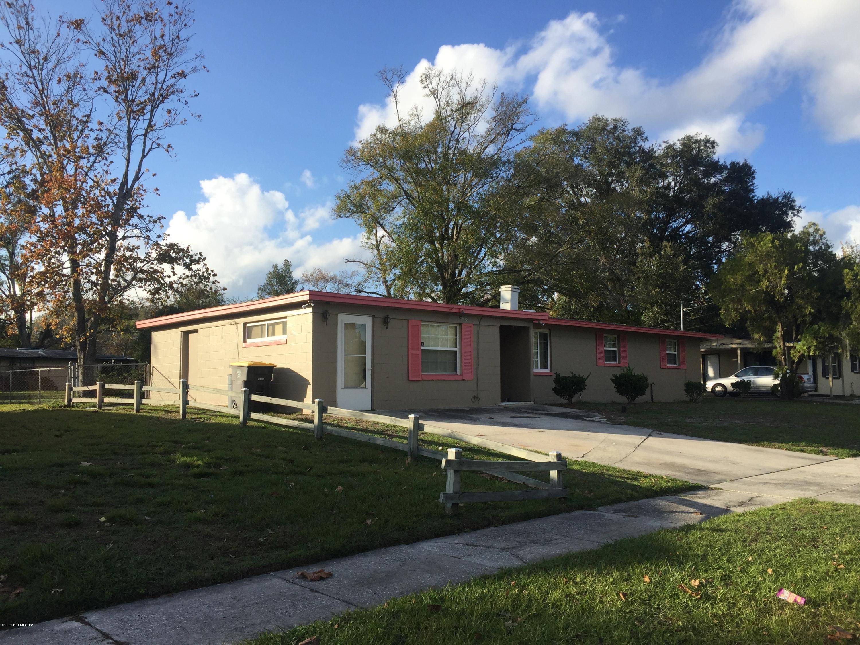 5838 Ensenada Road Jacksonville, FL 32244 - Photo 1 of 23 a view of a house with backyard and trees