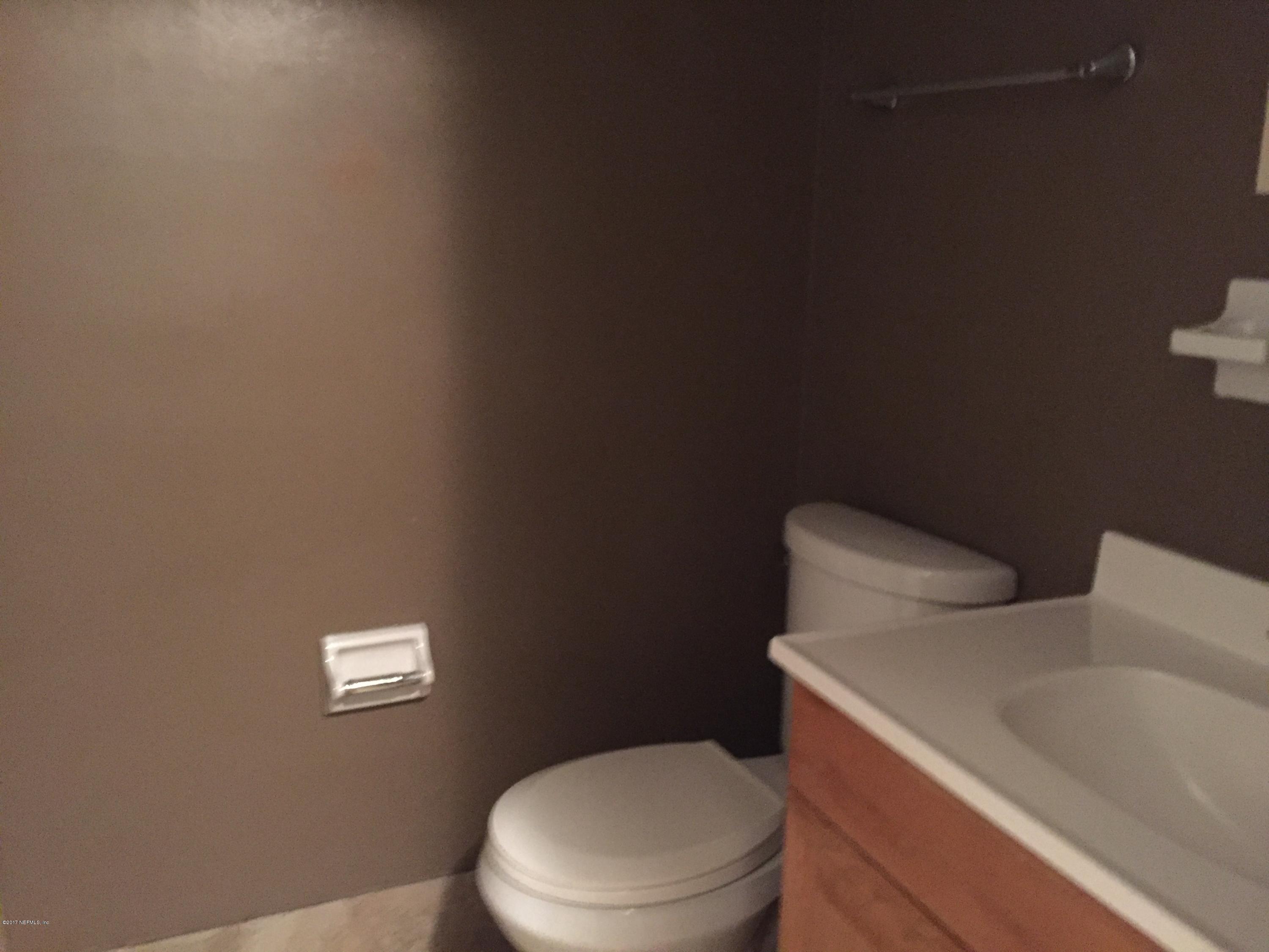 5838 Ensenada Road Jacksonville, FL 32244 - Photo 20 of 23 a white toilet sitting next to a white walls