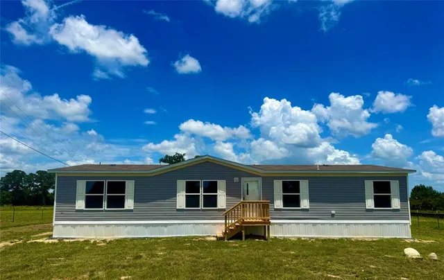 a front view of house with yard