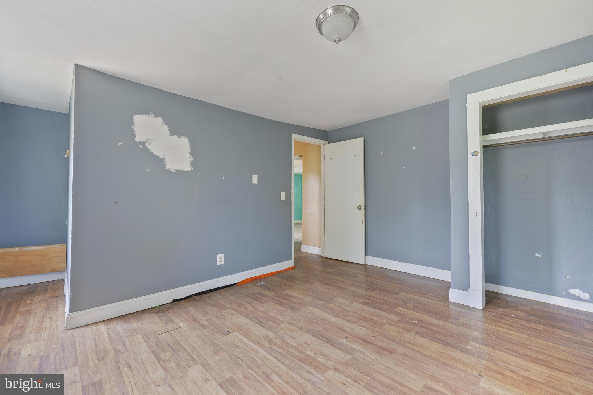 7401 Watersville Road Mount Airy, MD 21771 - Photo 11 of 26 a view of an empty room with wooden floor and a window