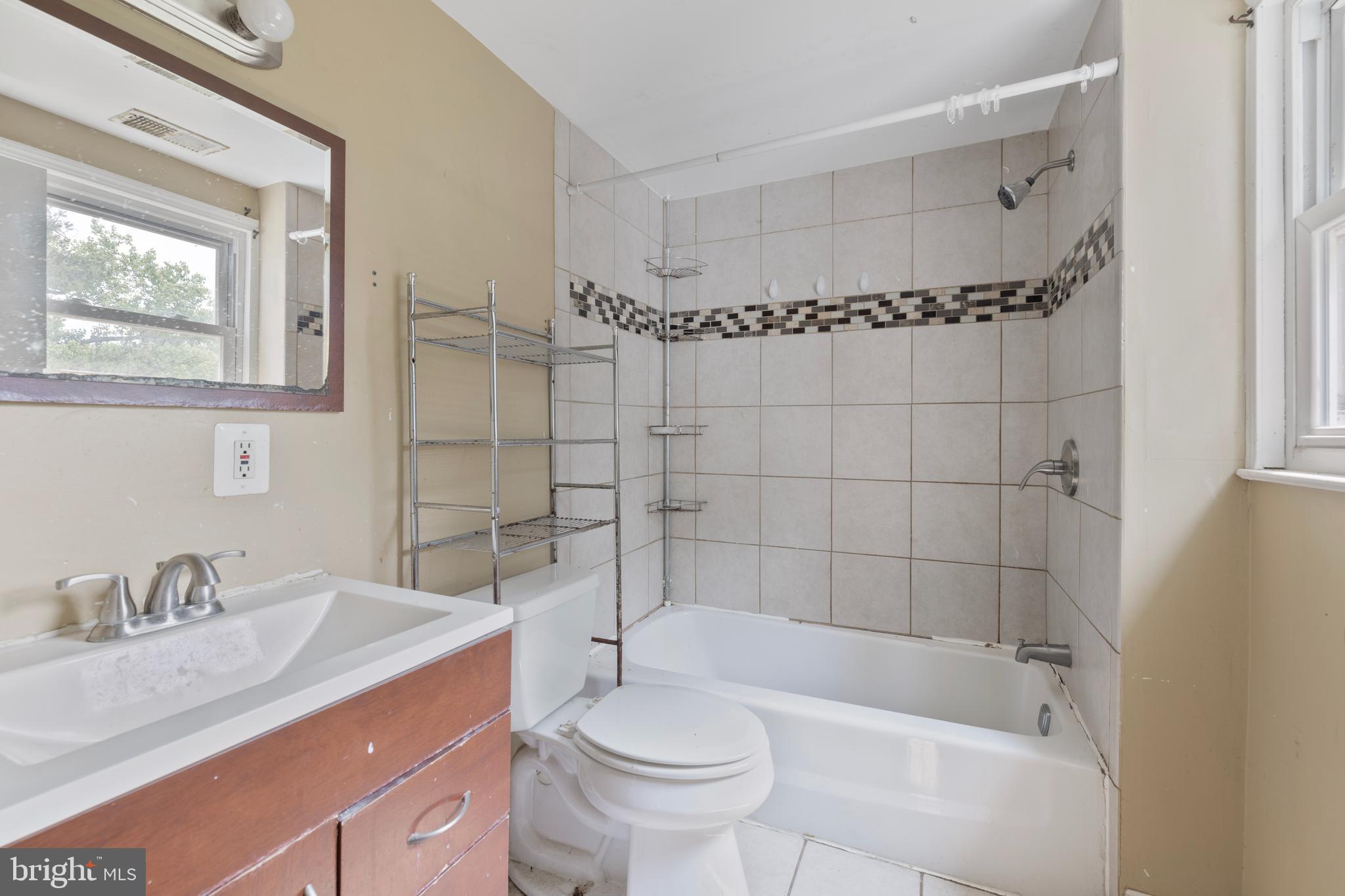 7401 Watersville Road Mount Airy, MD 21771 - Photo 12 of 26 a bathroom with a sink a toilet and shower
