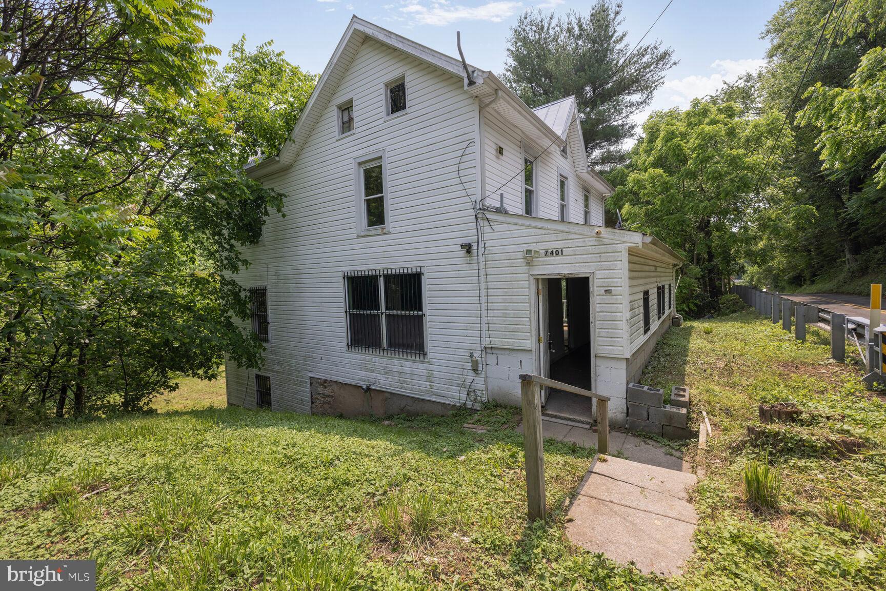 7401 Watersville Road Mount Airy, MD 21771 - Photo 15 of 26 a view of a house with a yard