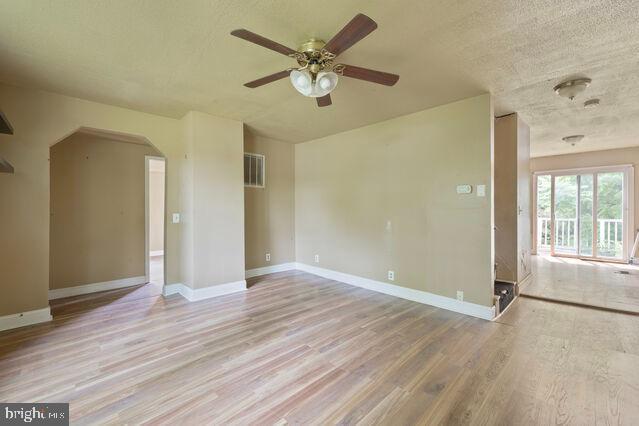 7401 Watersville Road Mount Airy, MD 21771 - Photo 4 of 26 wooden floor in an empty room with a window