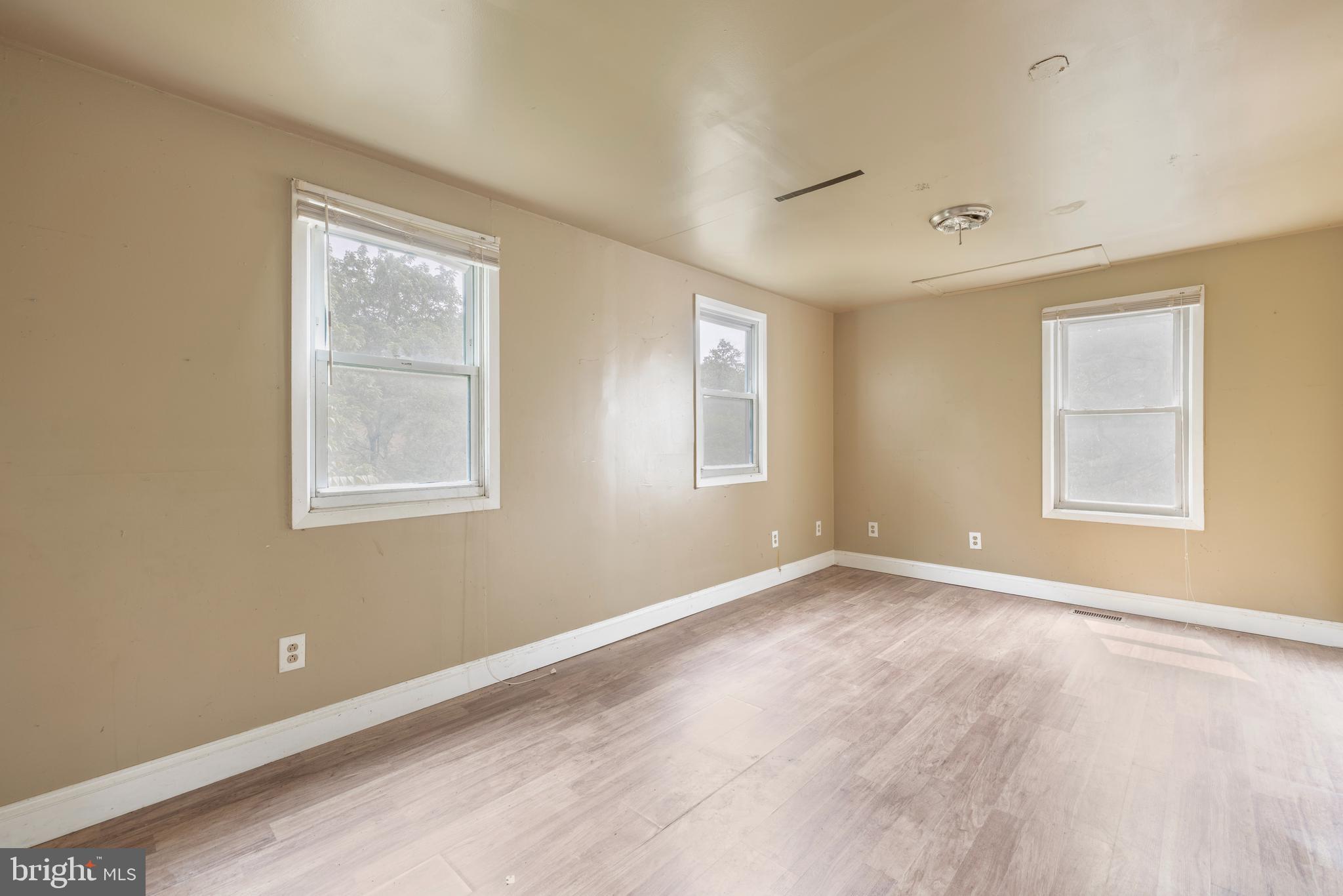 7401 Watersville Road Mount Airy, MD 21771 - Photo 7 of 26 an empty room with windows