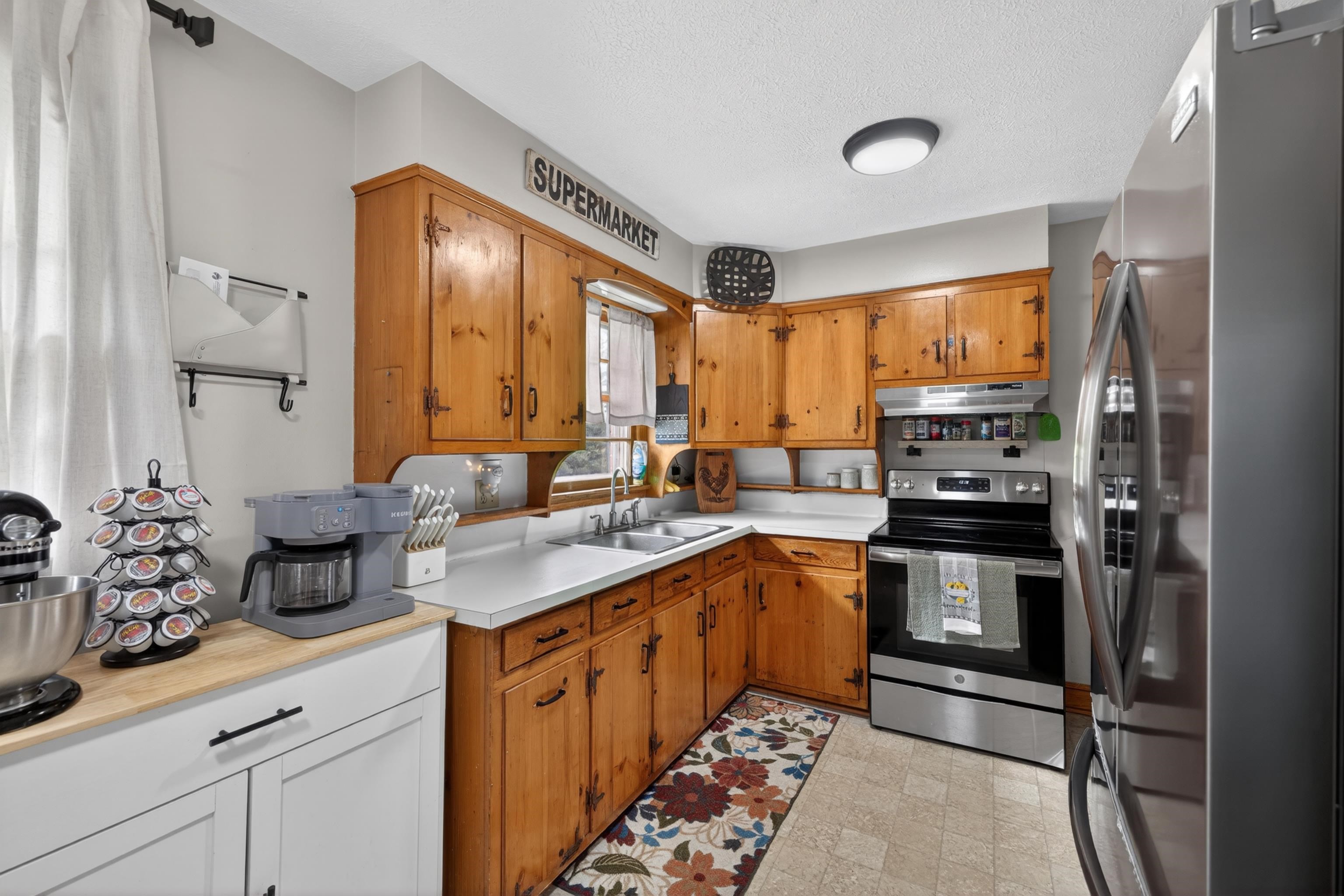 7827 Lee Highway Raphine, VA 24472 - Photo 17 of 62 a kitchen with stainless steel appliances a sink stove and refrigerator