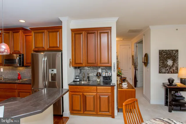 a dining room with a table and chairs