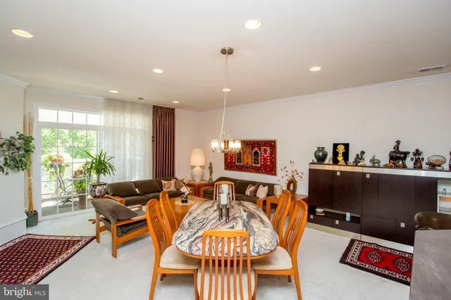 a dining room with a table and chairs