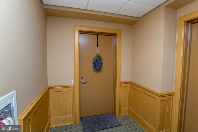 a kitchen with stainless steel appliances granite countertop a sink a refrigerator and a stove