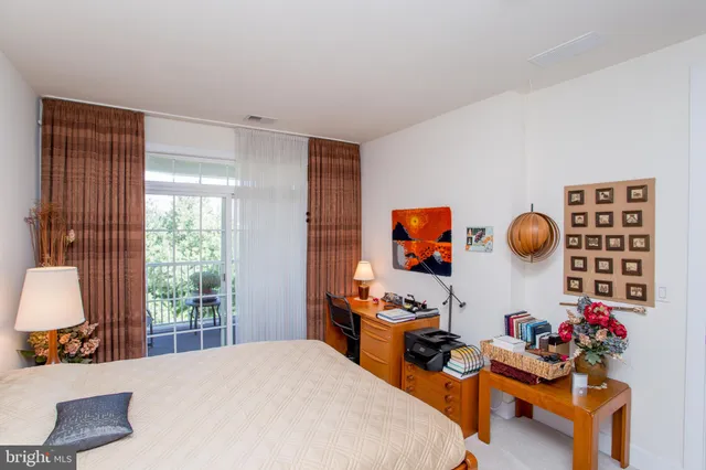 a view of a chair and table in the balcony