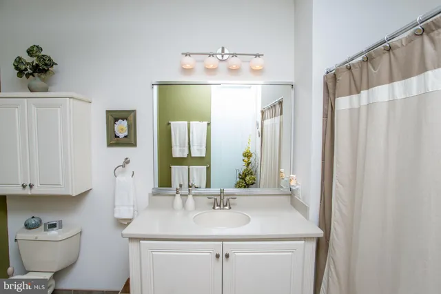 a view of storage and utility room with washer and dryer