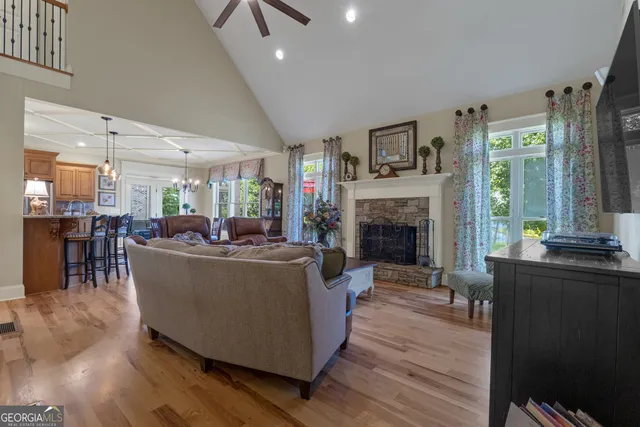 a kitchen with granite countertop stainless steel appliances a refrigerator sink and cabinets