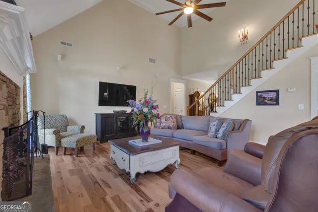 a large kitchen with stainless steel appliances granite countertop a stove refrigerator and cabinets